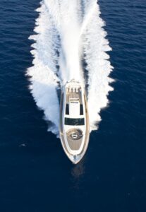 Aerial view of a motor yacht sailing.