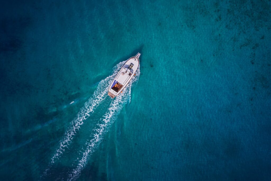 Boat using marine battery charger sails