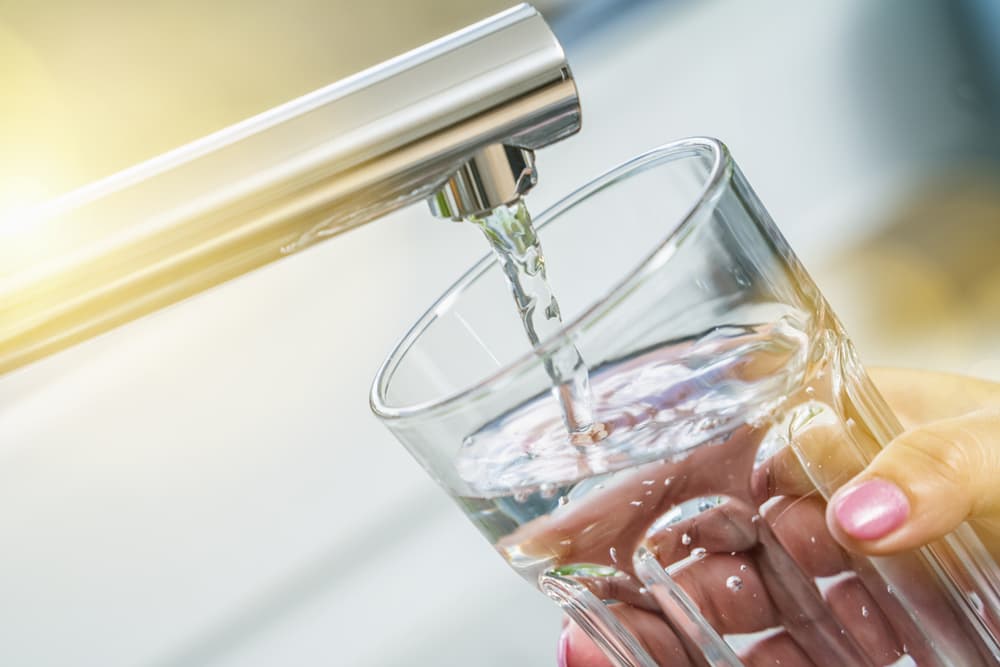 closeup-female-hands-nail-polish-glass-water-tab